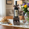 Wine bottle with a bow and chocolates in a box  for Purim 
