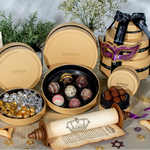 Decorative chocolate assortment in a Swarovski branded box with a mask and festive items on a neutral background.