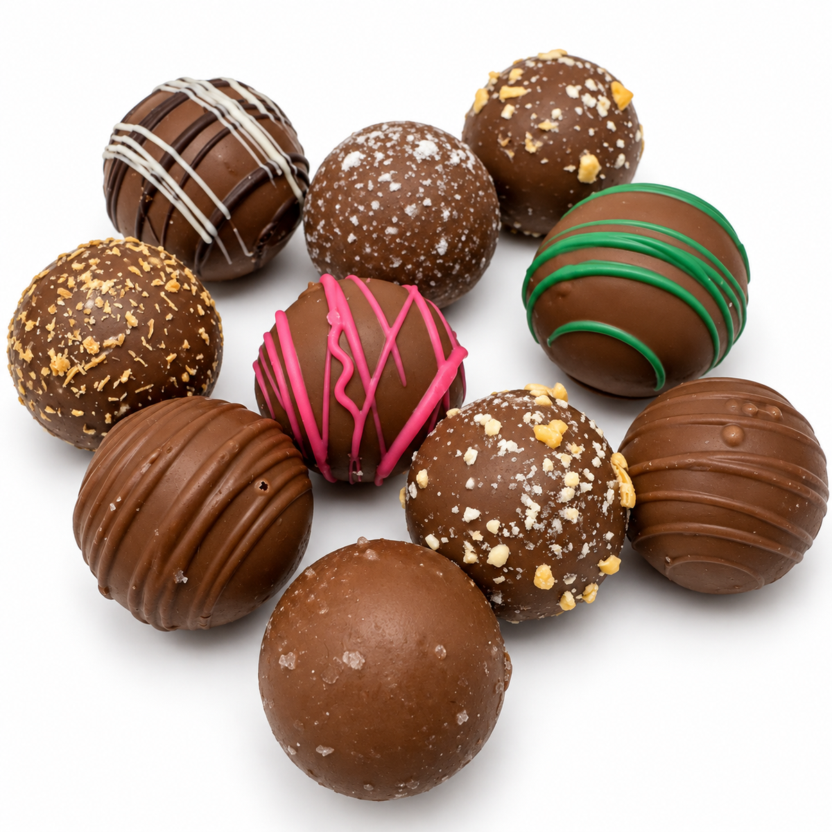 Kosherline assorted gourmet chocolate truffles with various toppings and drizzles on a white background