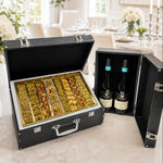Kosherline gourmet baklava and wine gift set in a black crocodile-embossed leatherette case on a marble countertop.
