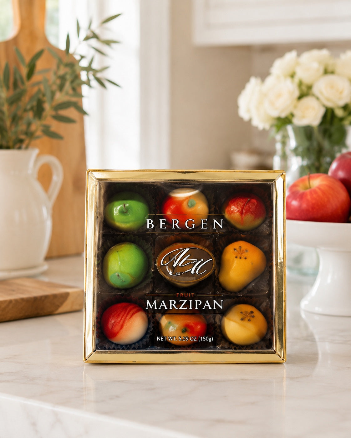 Kosherline Bergen fruit marzipan gift box featuring nine assorted realistic fruit-shaped candies in a gold-rimmed box.