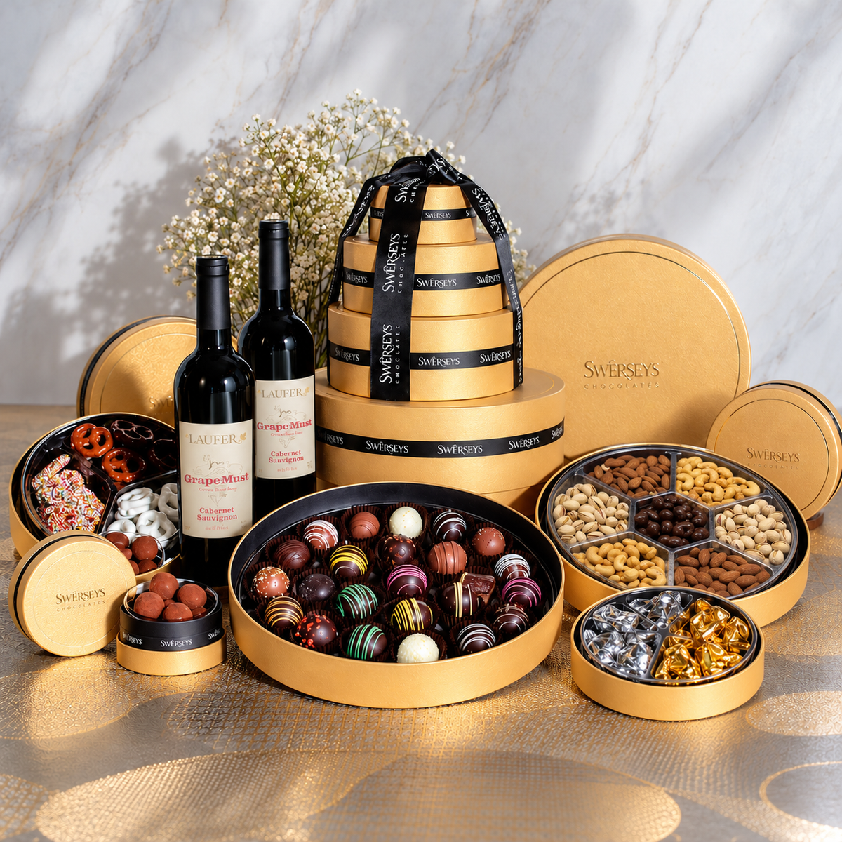 Kosherline 5-tier gold gift box filled with gourmet nuts, chocolates, and two bottles of non-alcoholic wine.