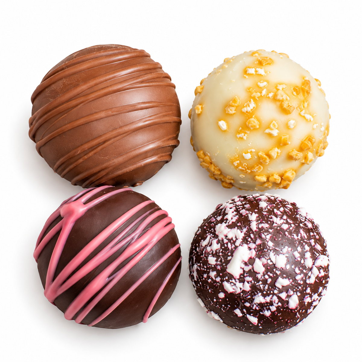 Kosherline gourmet chocolate truffles featuring milk, white, and dark chocolate with drizzle and nut toppings