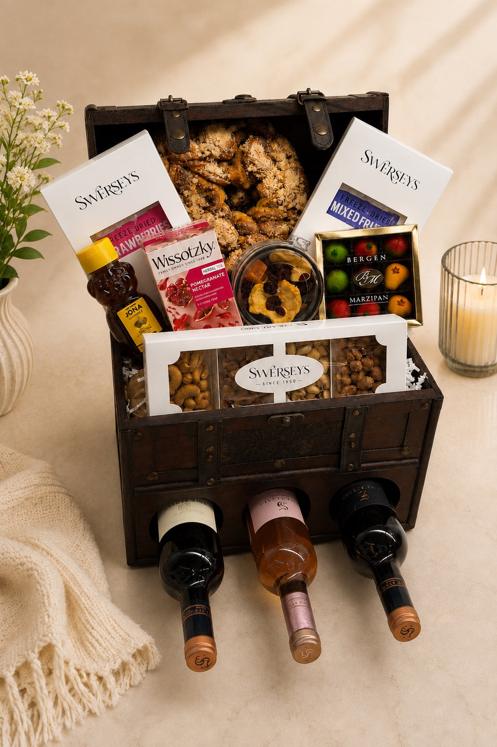 Kosherline Grand Reserve wooden wine chest filled with gourmet snacks, dried fruits, nuts, marzipan, and three wines.