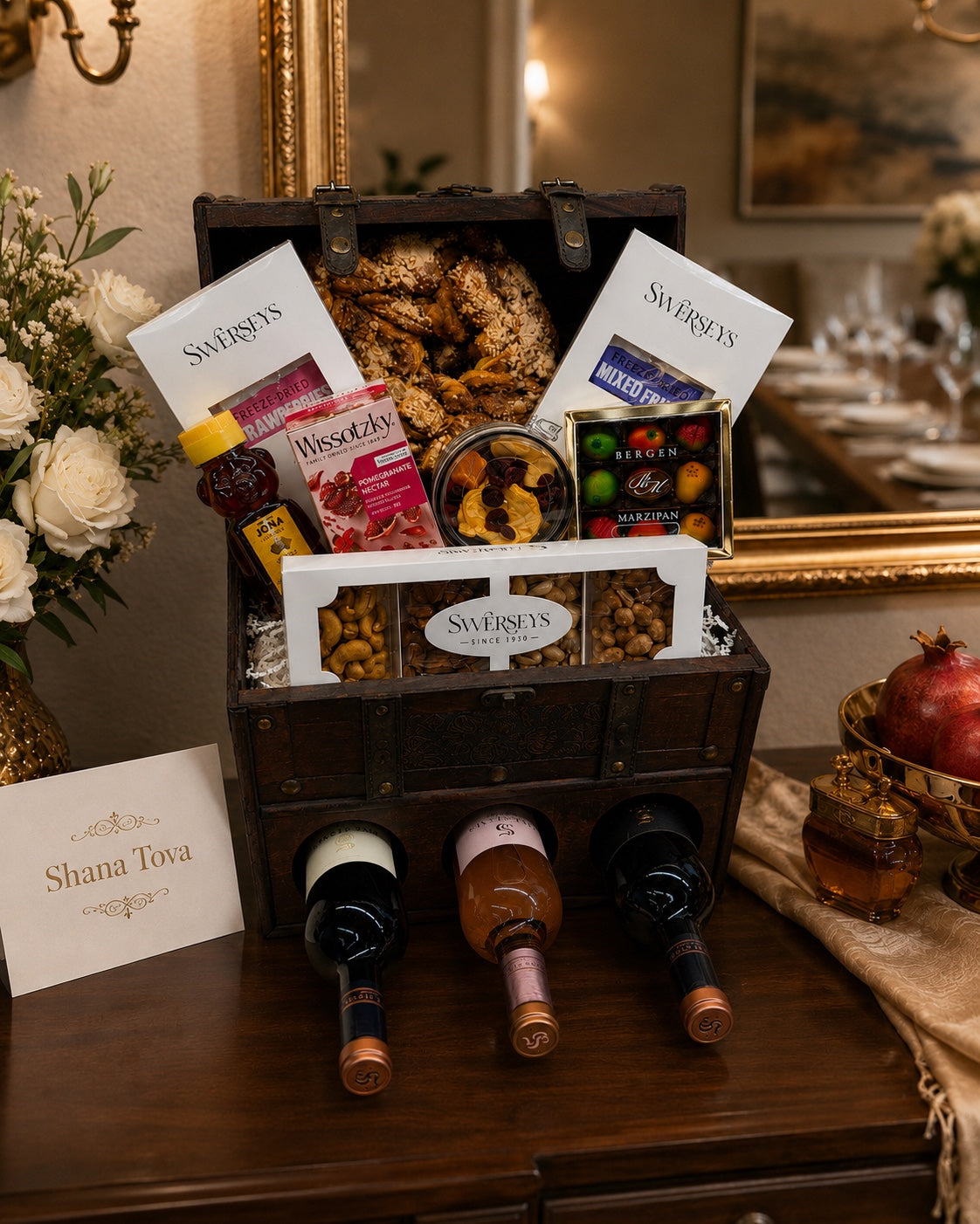 Kosherline Grand Reserve wooden wine and gourmet gift chest filled with wine bottles, nuts, fruit, and sweets.