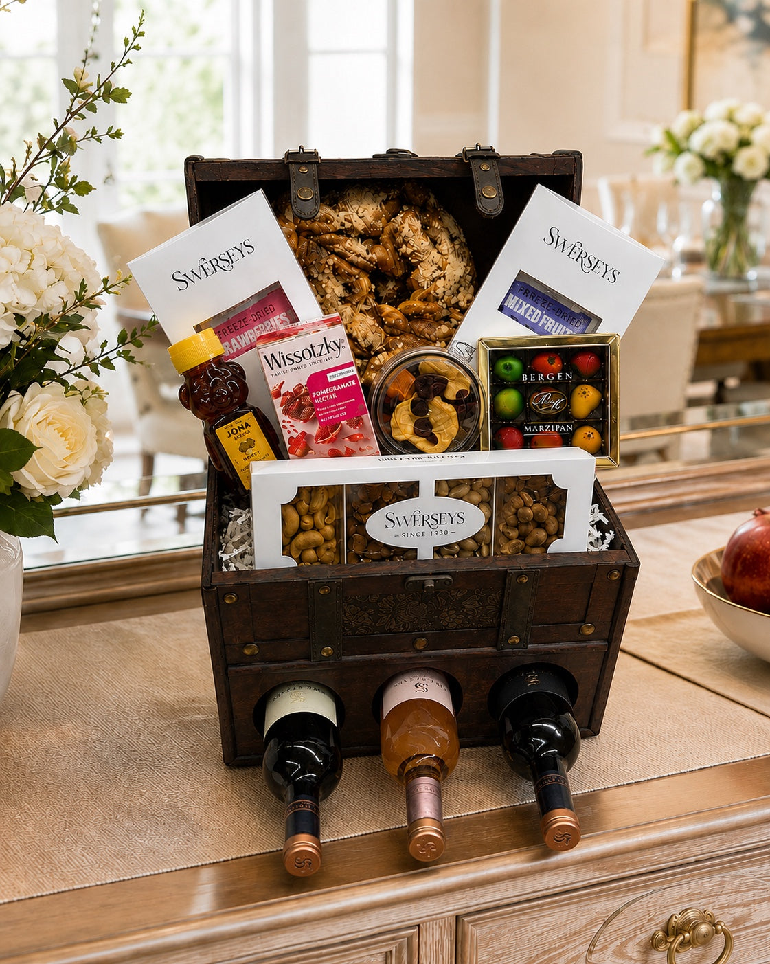 Kosherline Grand Reserve wooden chest filled with gourmet snacks, dried fruits, nuts, and three bottles of wine.