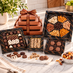 Kosherline 4 tier gift tower featuring assorted parve chocolates, roasted nuts, and chocolate-covered treats.