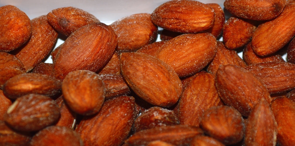 Kosherline gourmet roasted almonds with a light salt dusting, perfect for Rosh Hashanah snacking.