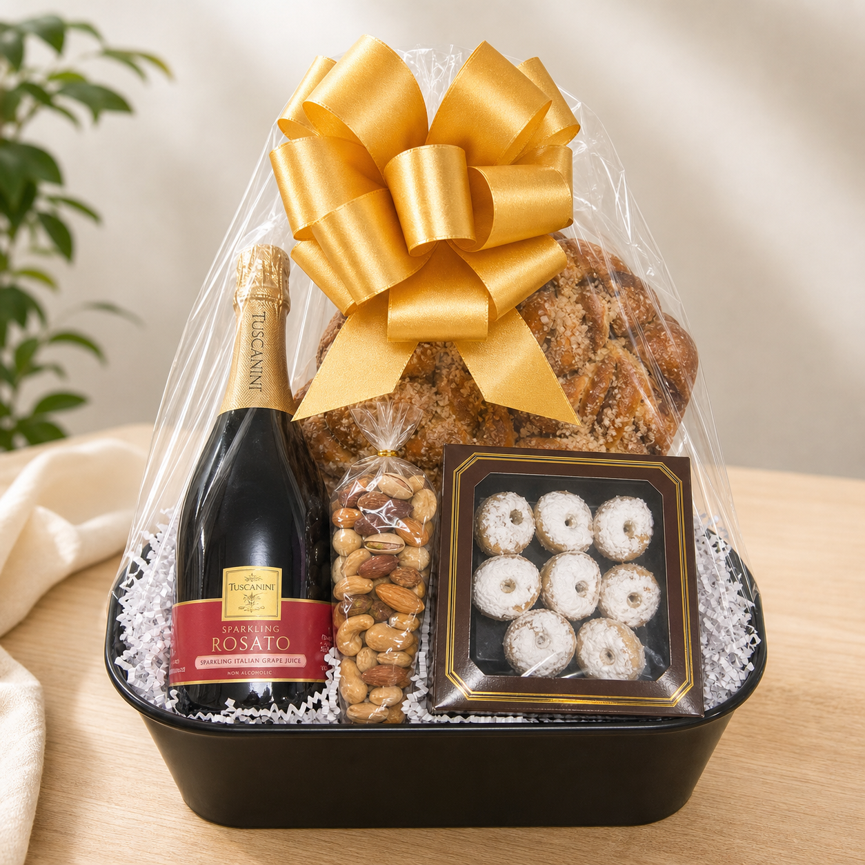 Kosherline Summer Rosato gift basket featuring sparkling grape juice, cinnamon babka, cookies, and nuts with a gold bow