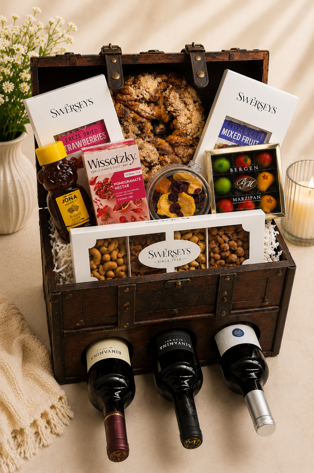 Kosherline Wine Chest 1 gift set featuring three wine bottles, Swersey's snacks, marzipan, honey, and herbal tea.