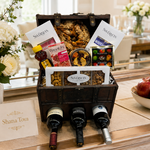 Kosherline Wine Chest 1 gift set featuring three wine bottles, assorted gourmet snacks, and sweets in a wooden trunk.